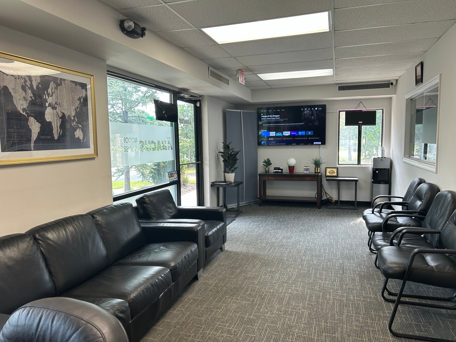 Solutions by Abacus waiting area with chairs and television